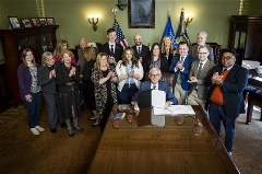 League staff and members from Blackhawk Community Credit Union attended bill signings