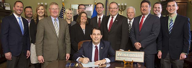 Governor Walker signs into law the third credit union supported bill passed unanimously this legislative session Governor Walker signs into law the third credit union supported bill passed unanimously this legislative session